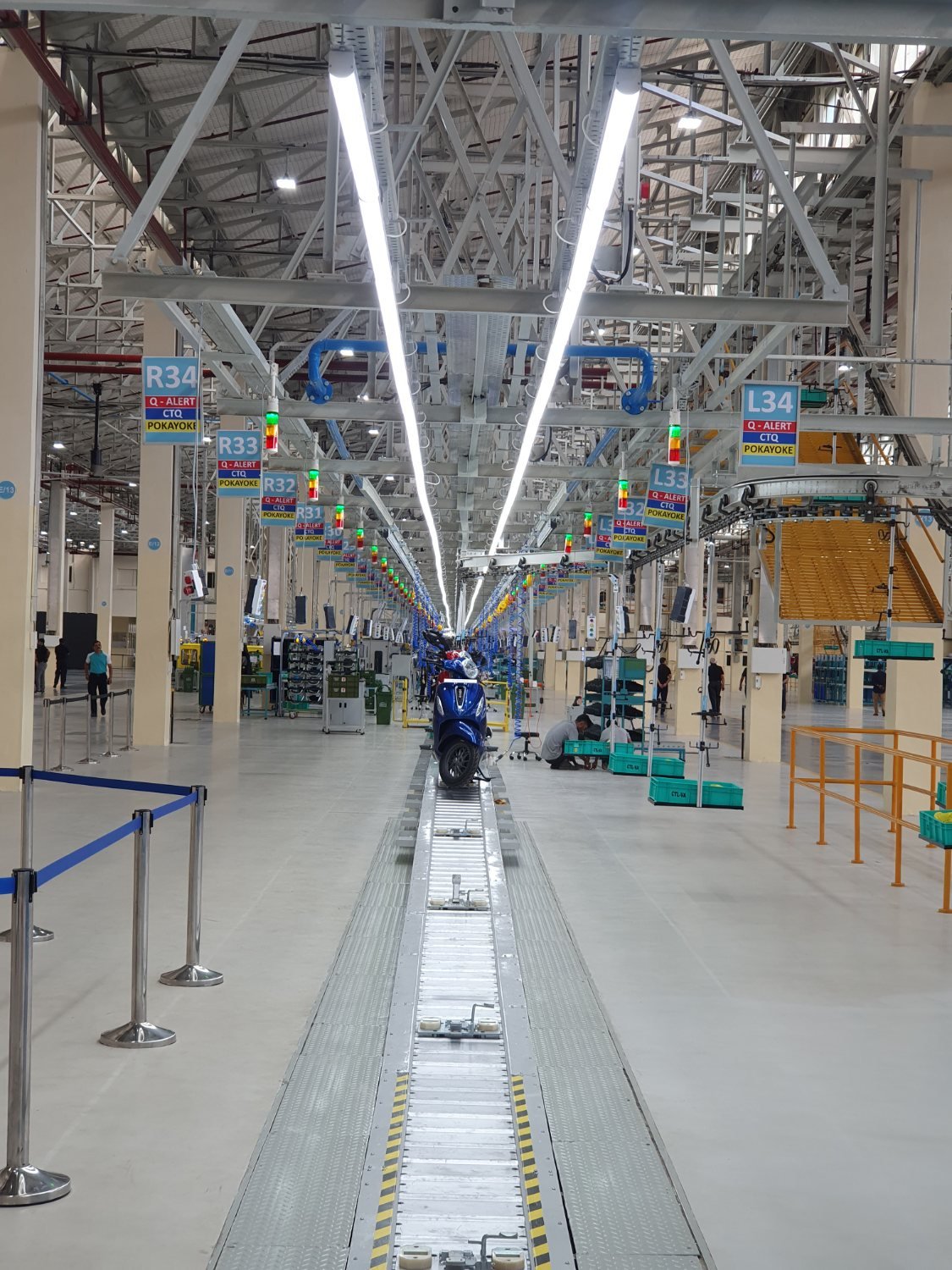 Blue Chetak EV scooter on the finished final-assembly line
