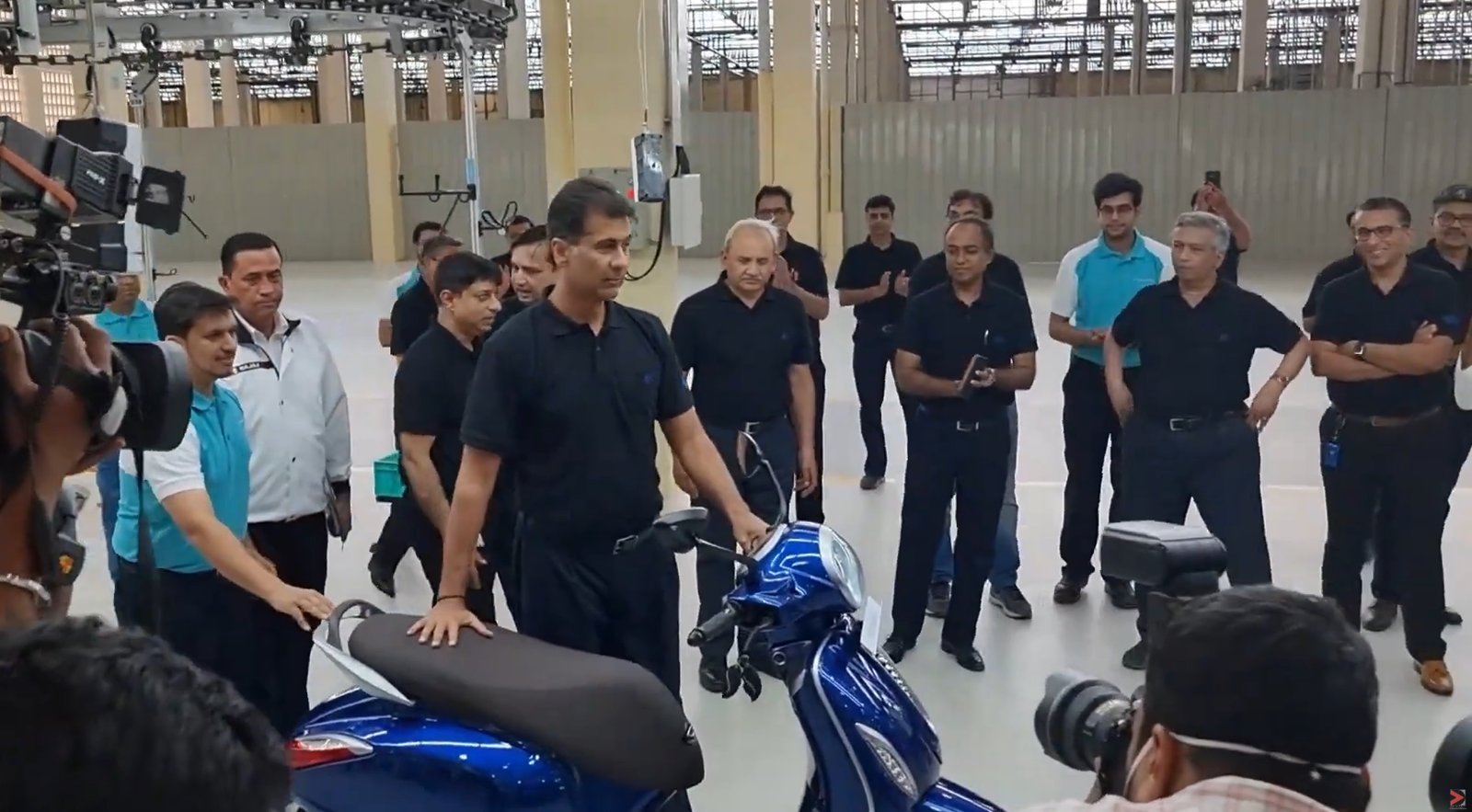 Bajaj Auto senior management walking the finished Chetak EV line at the first line-off