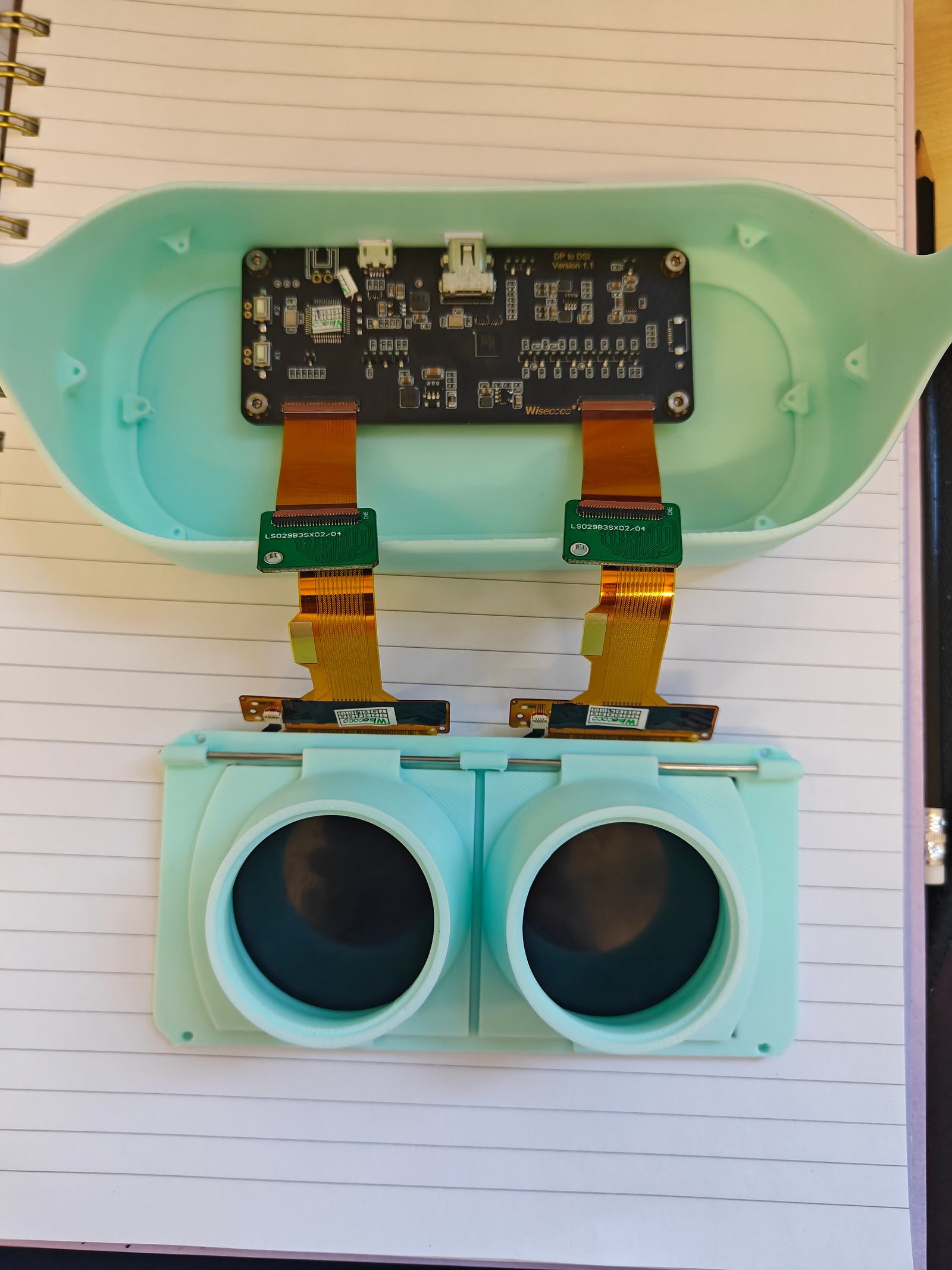 The twin-lens display module assembled into its printed housing