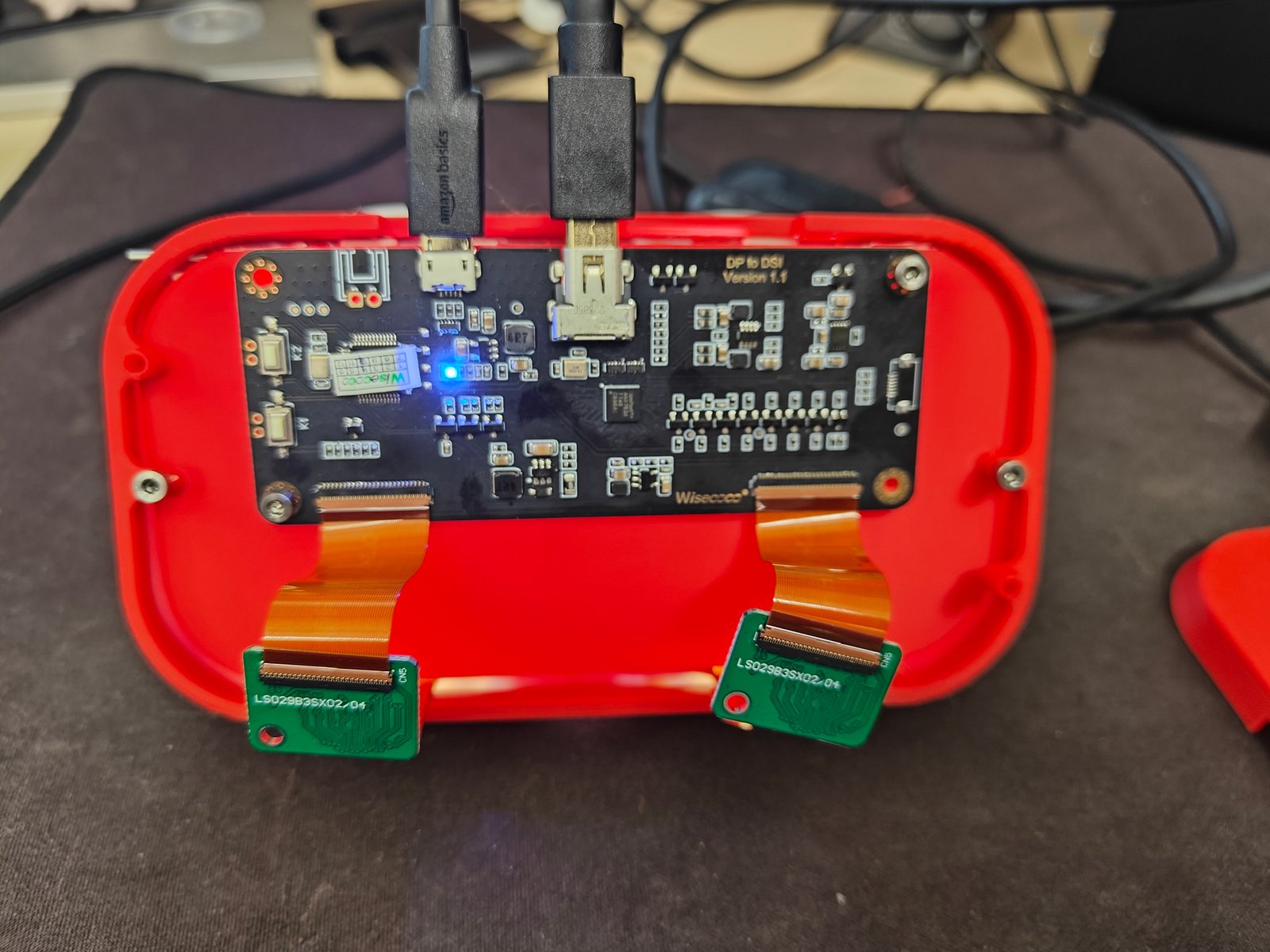 The DisplayPort-to-DSI driver board and twin micro-displays wired up and powered on